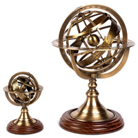 Bronze armillary spheres with wooden bases side by side small and large to show difference in height