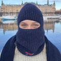 Person wearing navy balaclava.