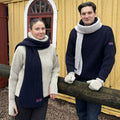 Two people wearing items from the Arthur Beale X National Maritime Museum range.