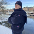 Person wearing navy items from the Arthur Beale X National Maritime Museum range.