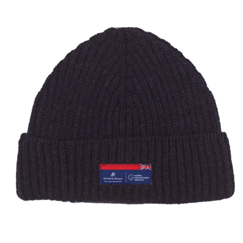 Navy knitted beanie hat with Arthur Beale X National Maritime Museum label.