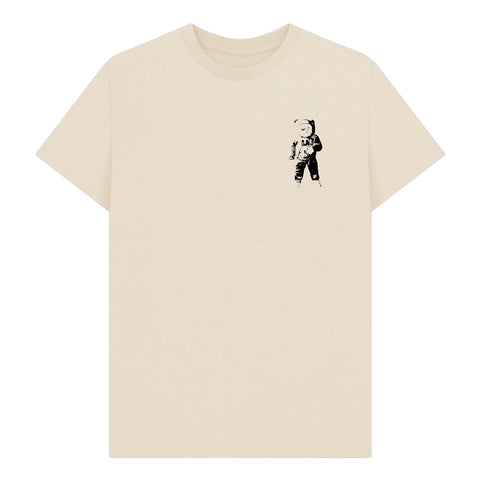 Beige t-shirt with a black astronaut graphic on the chest