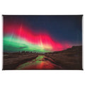 A rectangular fridge magnet featuring a vibrant photograph of the northern lights (aurora borealis) over a dark landscape with a reflective stream