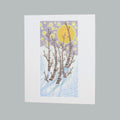 A vertical greeting card featuring a stylized winter forest scene with birch trees, a large yellow moon, and a lavender sky