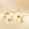 Gold ring with blue cubic zirconia stones