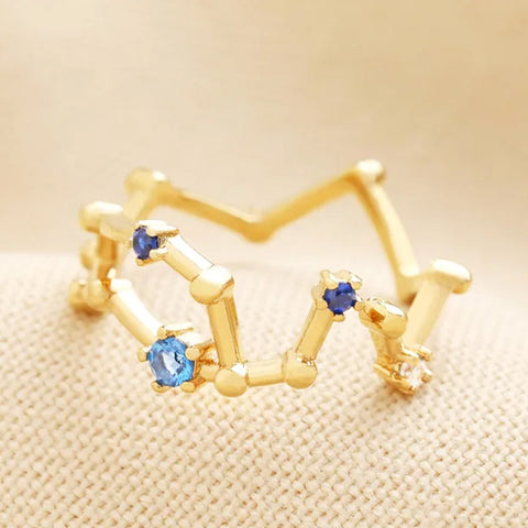 Gold ring with blue cubic zirconia stones