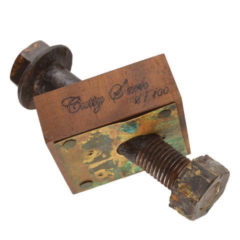 Rust-coluored metal bolt with 'Cutty Sark' engraving 