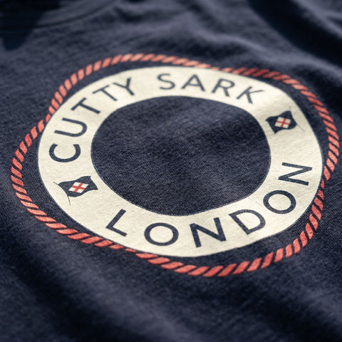 Close-up of a Cutty Sark logo on a dark fabric background
