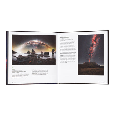 An open hardcover book showing two spread pages with landscape photographs and text. The left page features a dark rocky seascape under a glowing galaxy, and the right page shows a volcanic mountain scene with red lava against a dark sky.