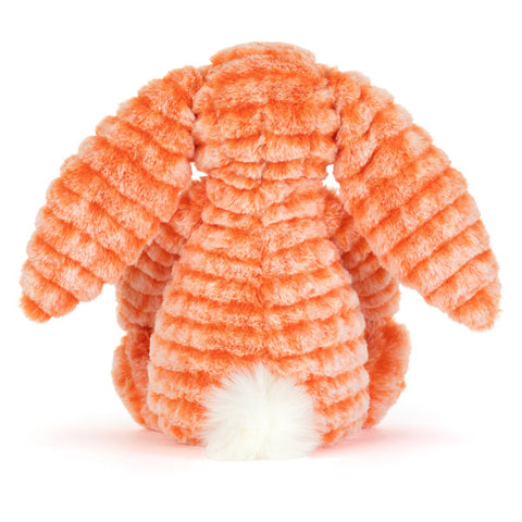 Orange bunny plush soft toy seen rom the back