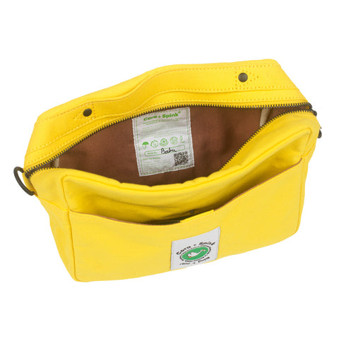 Yellow pouch with a visible brand label on a white background