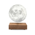 A floating moon lamp with a detailed gray moon surface on a rectangular wooden base