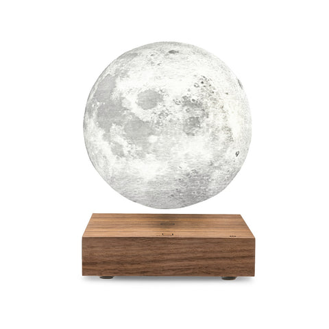 A floating moon lamp with a detailed gray moon surface on a rectangular wooden base