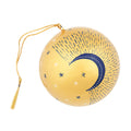 A round gold-colored hanging ornament decorated with a navy blue crescent moon, white stars, and radiating dotted lines