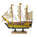 Small HMS Victory model ship with extended sails.