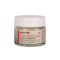 A jar of lip balm with bay, lemon and spearmint essential oils