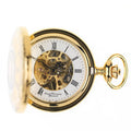 Open gold pocket watch with visible mechanism behind a black and white watch face.