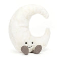 White plush toy shaped like a crescent moon with a smiling face