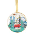 Decorative ornament with London-themed design featuring Big Ben, the London Eye, and a red bus on a white background.