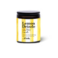 Lemon Drizzle soy wax candle in a yellow and black container 