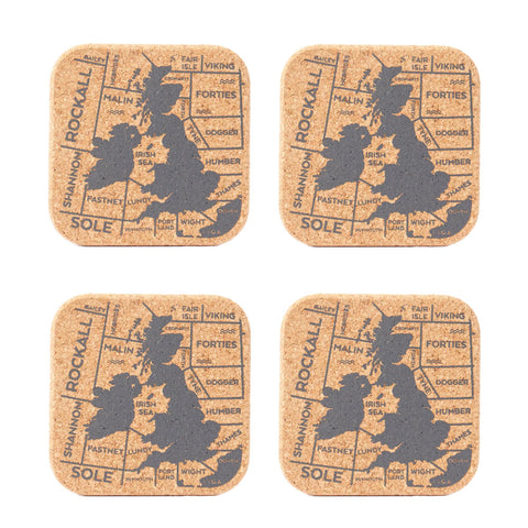 Set of four cork coasters with map design and text 