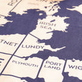 Map of UK with coastal towns labelled printed on a textured surface