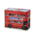 A red double-decker bus-shaped tin with a Union Jack pattern on the lid, featuring a Christmas-themed window sign that reads 'CHRISTMAS PATROL' and 'LONDON TRAVEL'.
