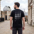 Man wearing a black t-shirt with Moon Phases design print and Royal Museums Greenwich logo printed on the back