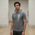 Man wearing a grey prime meridian tshirt