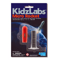 Packaging of KidzLabs Micro Rocket science kit with red rocket and clear container on a dark blue background.