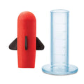 Red and black object with a blue cylindrical container 