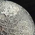 Close-up of a textured surface of a Moon sculpture showing craters on the Lunar surface