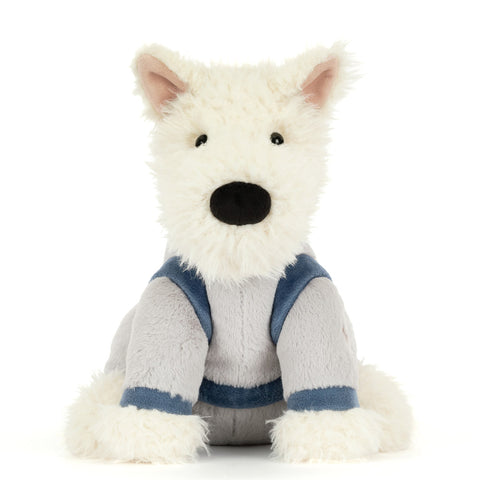white dog plush toy wearing a space suit 