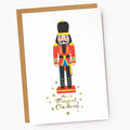 Greeting card with a colorful nutcracker illustration and 'Have a Magical Christmas' text on a white background.