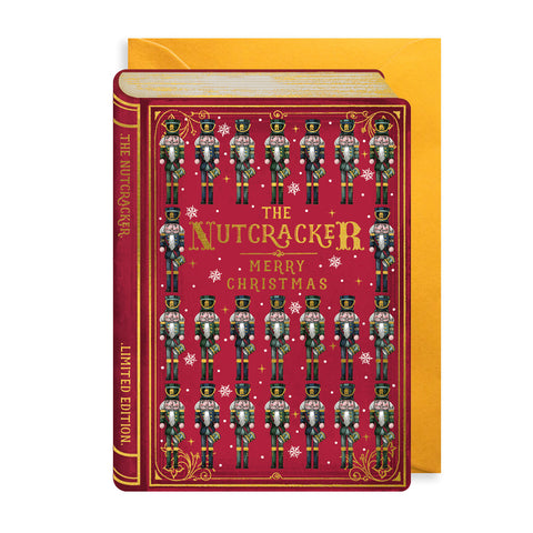 Christmas card with a decorative book with 'The Nutcracker' design on a red background