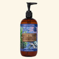 Hand and body wash bottle with ocean-themed label on a beige background