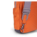 orange crossbody bag with adjustable shoulder strap, close up of side pocket detail