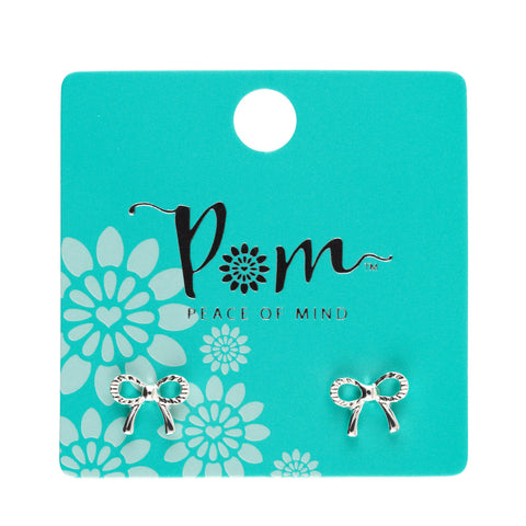 Bow-shaped earrings on a 'Peace of Mind' branded card with floral design