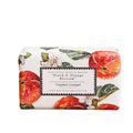 A rectangular bar of soap wrapped in white paper featuring watercolor illustrations of peach and orange fruits, green leaves, and white blossoms, with a central black-bordered label reading 'Peach & Orange Blossom' and 'Toasted Crumpet'.
