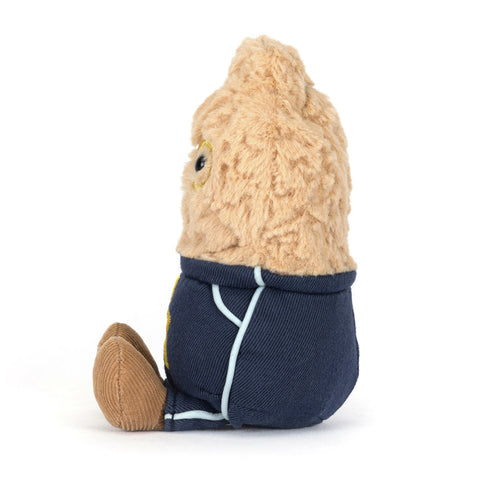 Stuffed toy resembling a peanut with a navy blue outfit 