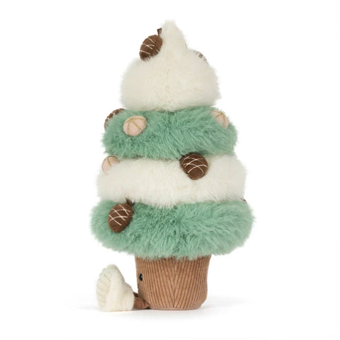 A plush toy shaped like a tiered Christmas tree, with fluffy white and mint green layers, brown pinecone ornaments, and a brown corduroy base.