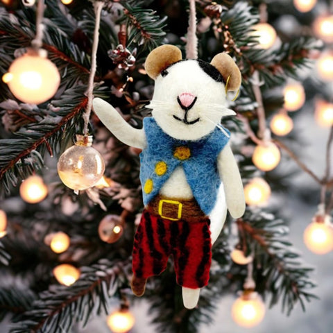 Decorative mouse ornament in a festive setting with Christmas lights and tree.