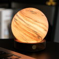 Wooden texture lamp on a dark surface with blurred background