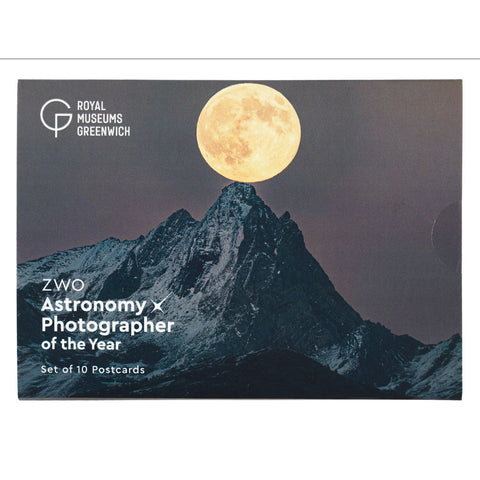 A postcard set cover or package featuring a mountain landscape with a large full moon, with white text reading 'Royal Museums Greenwich' and 'ZWO Astronomy x Photographer of the Year Set of 10 Postcards'.