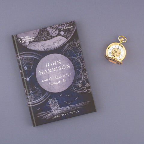 John Harrison and the Quest for Longitude next to a pocket watch.