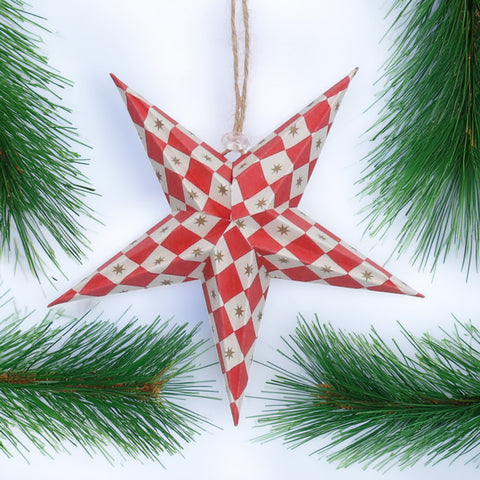red and white star decoration on a Christmas tree