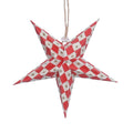 A five-pointed star Christmas ornament with a red and white harlequin pattern and small gold star details, hanging from a jute string 