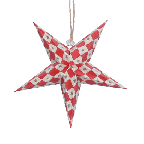 A five-pointed star Christmas ornament with a red and white harlequin pattern and small gold star details, hanging from a jute string 