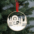 Decorative Christmas ornament with a London cityscape design on a tree.