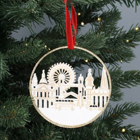 Decorative Christmas ornament with a London cityscape design on a tree.